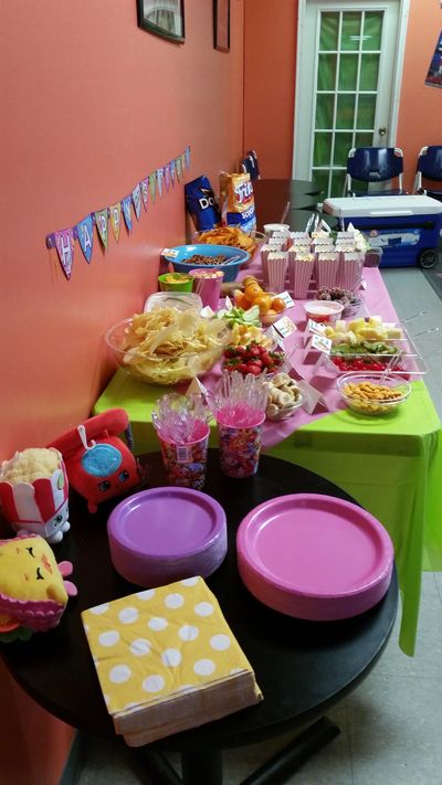 Table set up with snacks and decorations for a party.