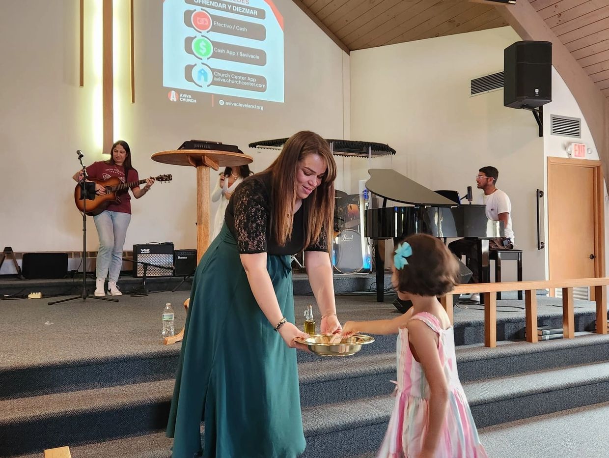Little Girl giving an offering to the usher in church 