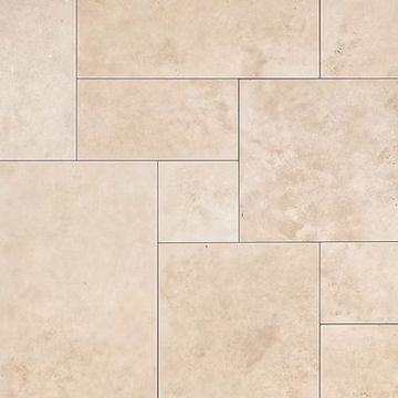 Beige stone tile flooring with a staggered rectangular pattern.