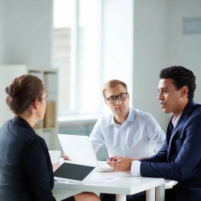 Three persons are talking