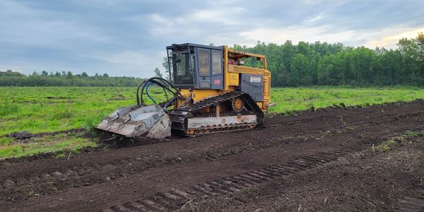 CMI mulcher subsoiling with FAE subsoiler in a land clearing project near Earlton ON