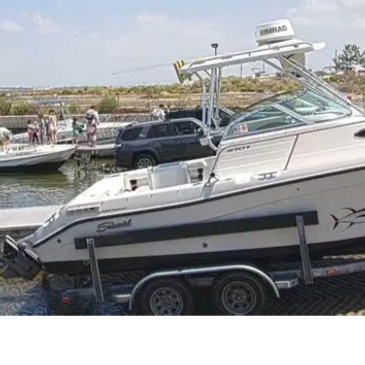 Boat on trailer at boat ramp