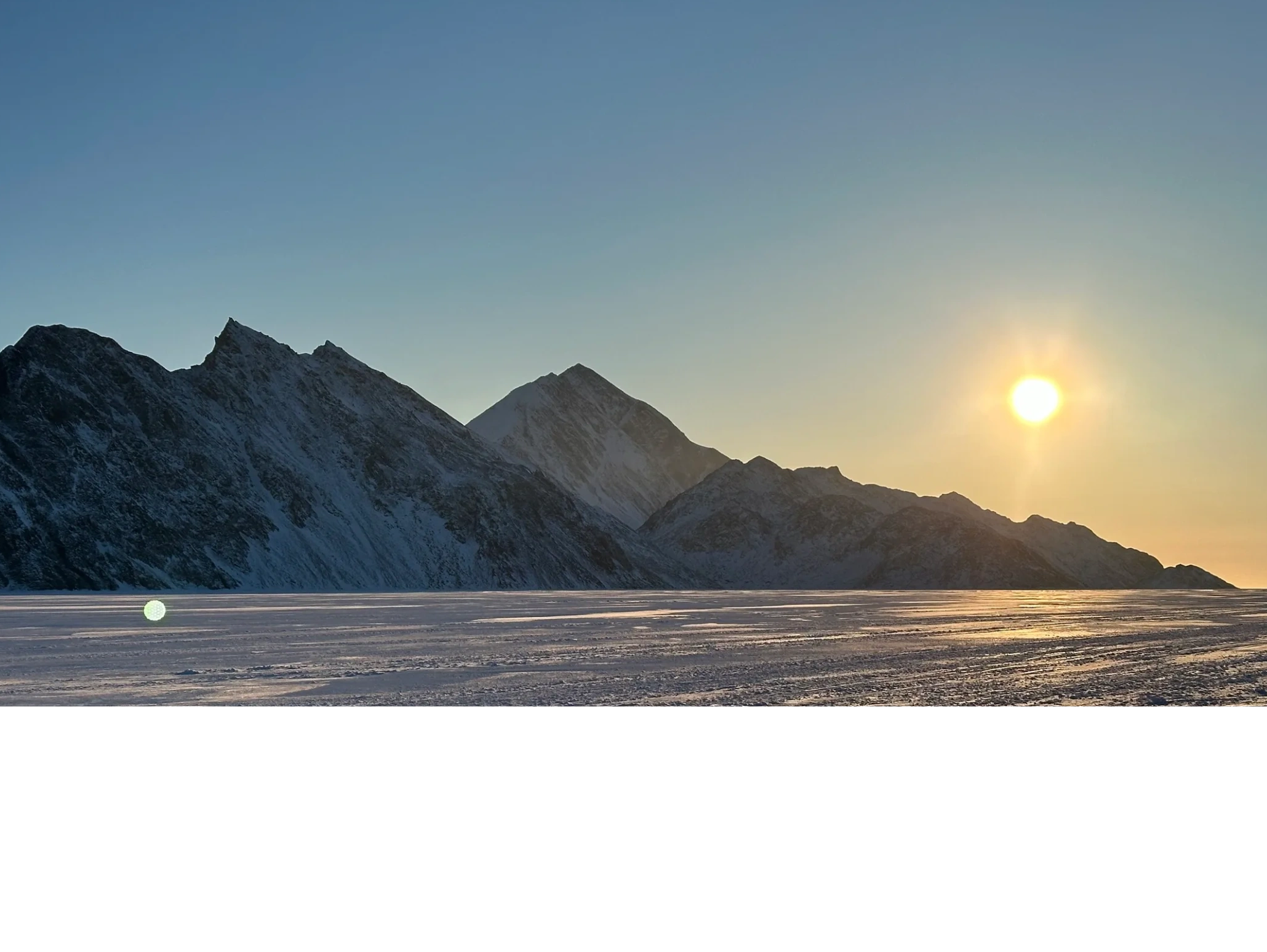 peaks of northern Baffin Island in late afternoon springtime. eclipse sound sea ice,  Nunavut