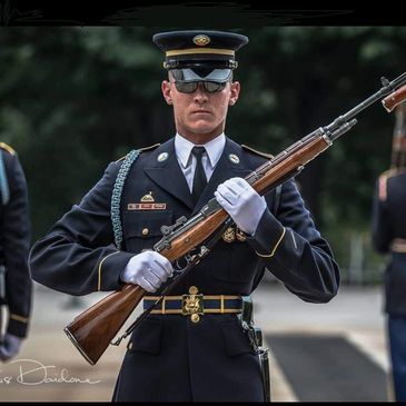 An Officer Holding A Gun In Hand