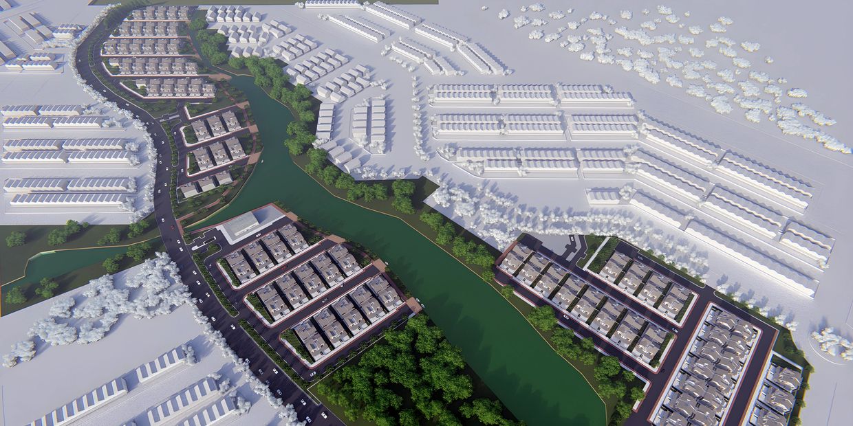 Aerial view of a planned residential neighborhood with a river and green spaces.