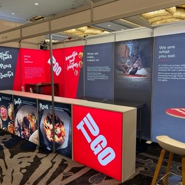 Red & gray modular, flexible, reusable display for exhibition shell spaces. 