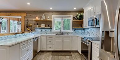 Complete Kitchen Renovation, Kitchen cabinets, counters, Tile backsplash, Kitchen sink, and flooring.
