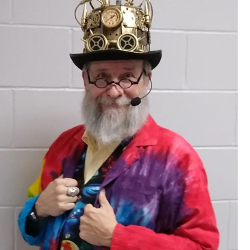 An image of the Professor Newton character in his colorful tie-dyed lab coat and steampunk hat