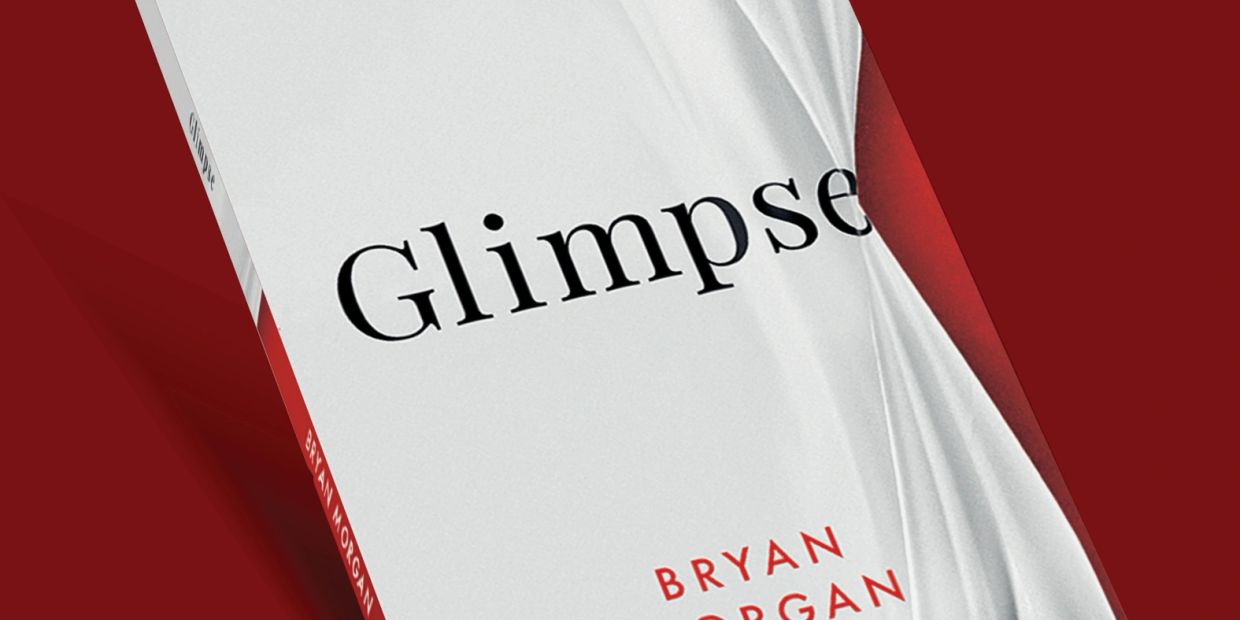 Close-up of a book titled "Glimpse" by Bryan Morgan.