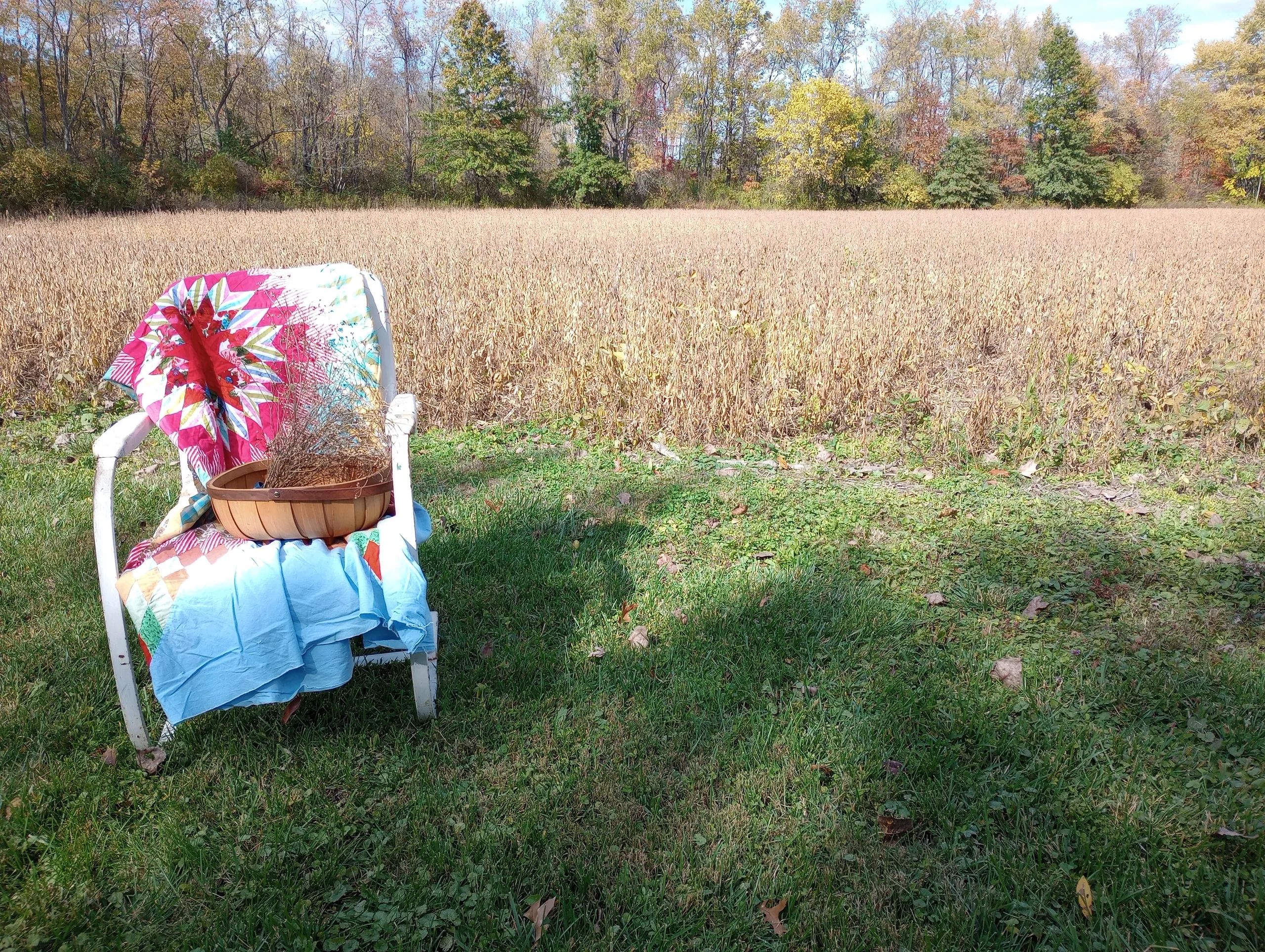 Vintage quilt, chair, and basket