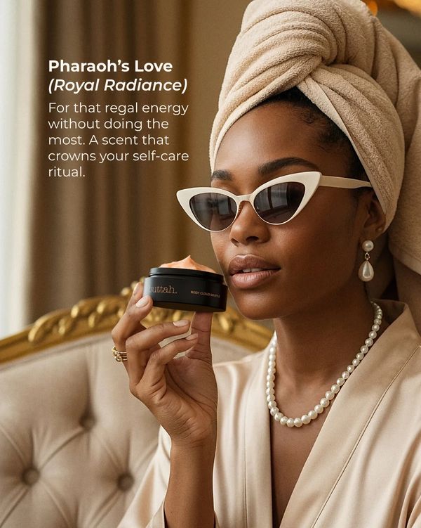 Woman in towel and pearls holding a skincare product, embodying regal self-care.