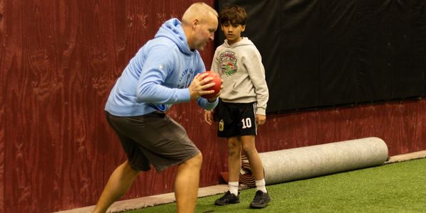 Fitness instructor with a medicine ball