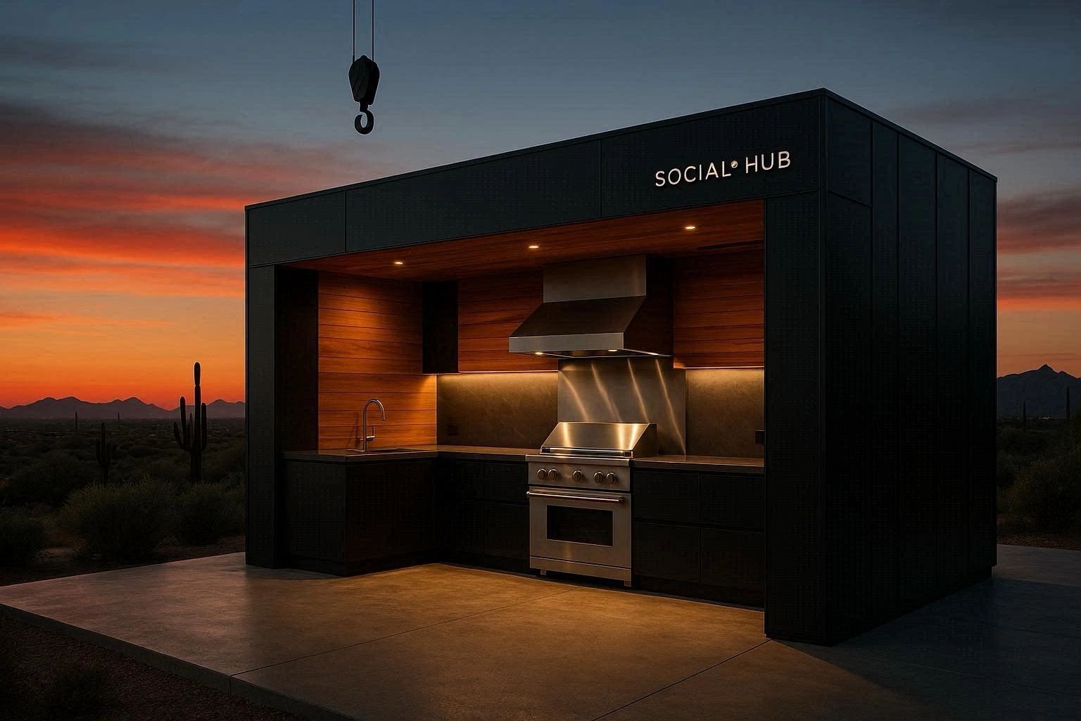 Modern outdoor kitchen hub illuminated at sunset in a desert landscape.