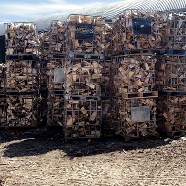 Seasoned logs in cages facing the sun and wind!