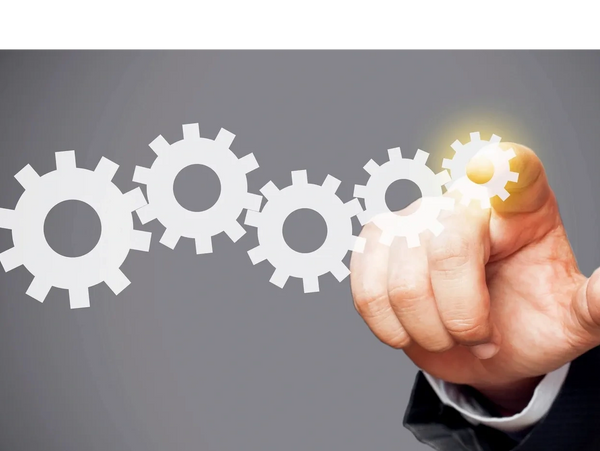 Sales atregy alignemnt demonstrated by gears lining up and a hand rotating the gears