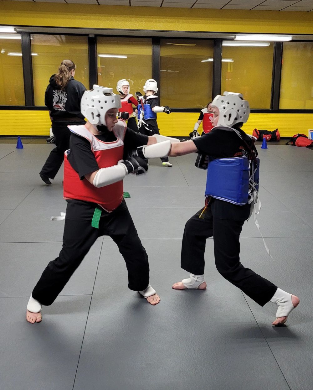 Sparring practice in full protective gear