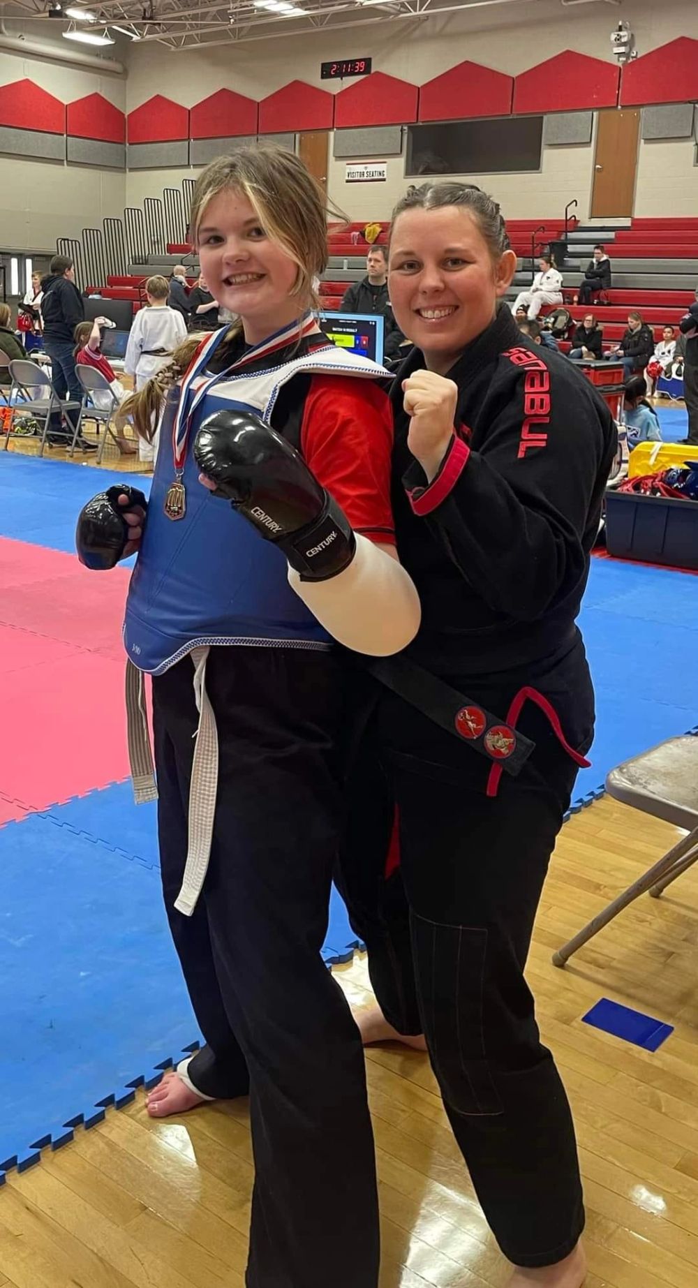Shifu Alexis Potter with an adult student after a competition