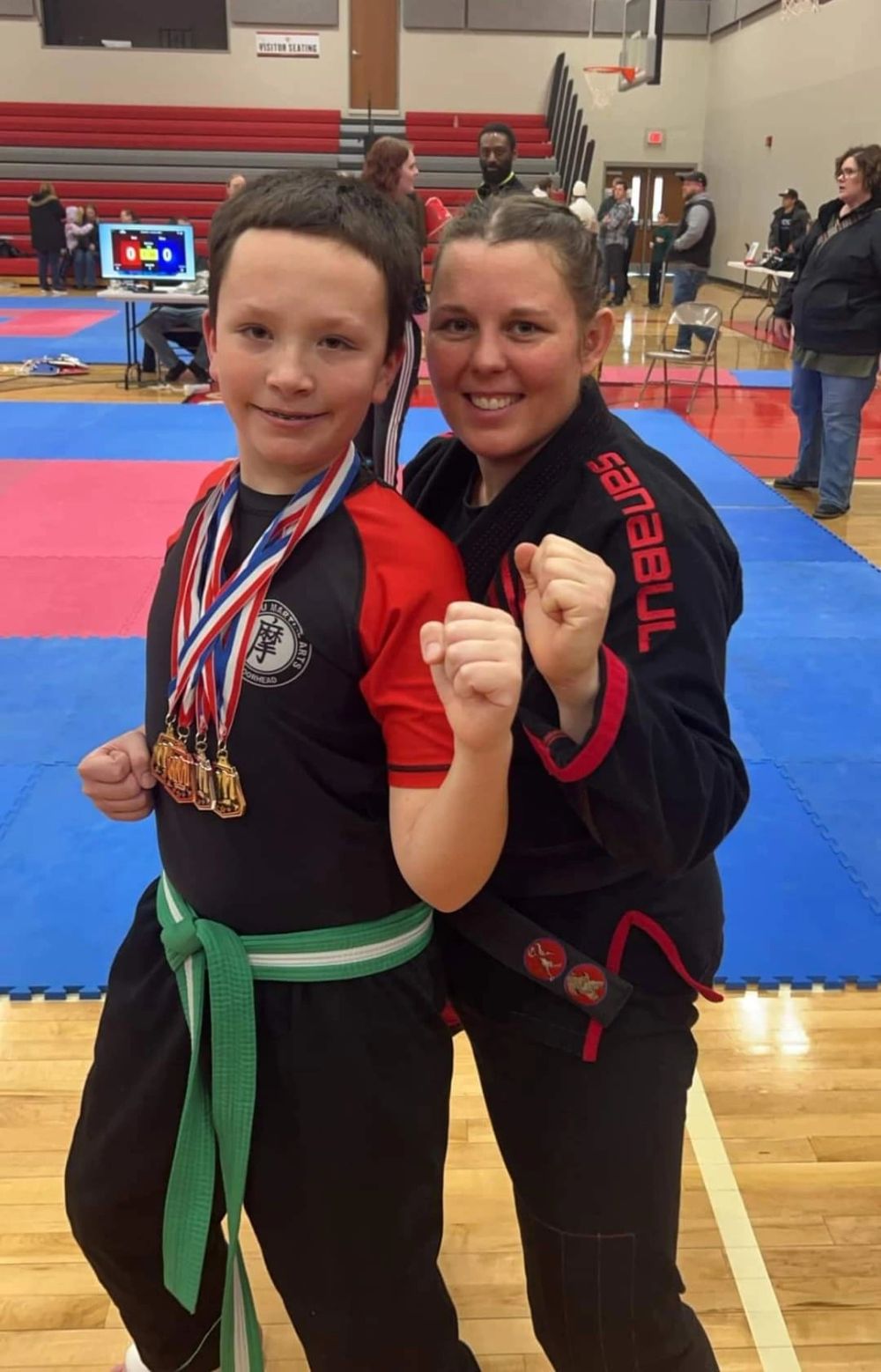 Shifu Alexis Potter with a medal-winning student