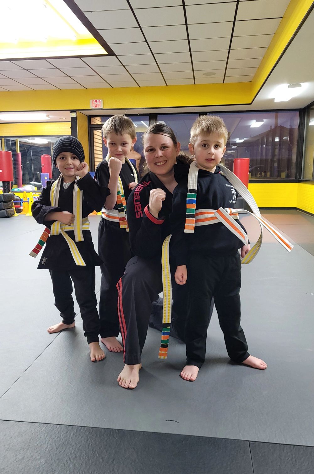 Shifu Alexis with three Little Dragons students