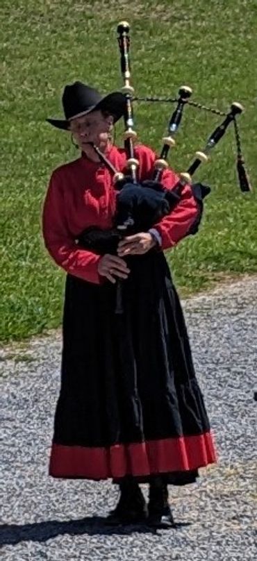 Isobel Ripper playing Amazing Grace on her bagpipes at Cherokee Deacon's memorial service.