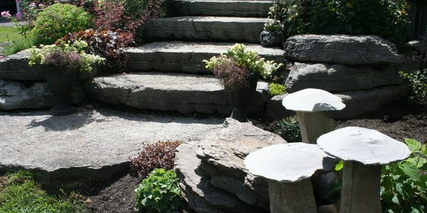 Stone staircase with gardens and custom made stone mushroom art 
