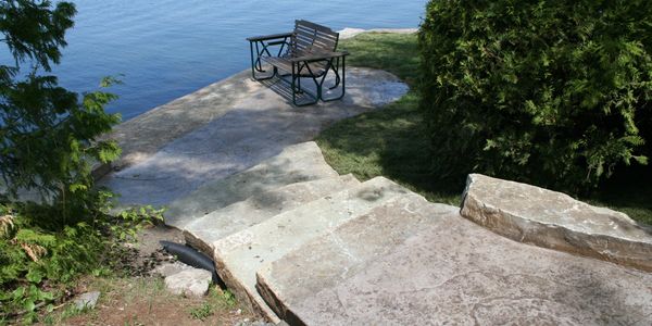 Stone steps down to lake at cottage
