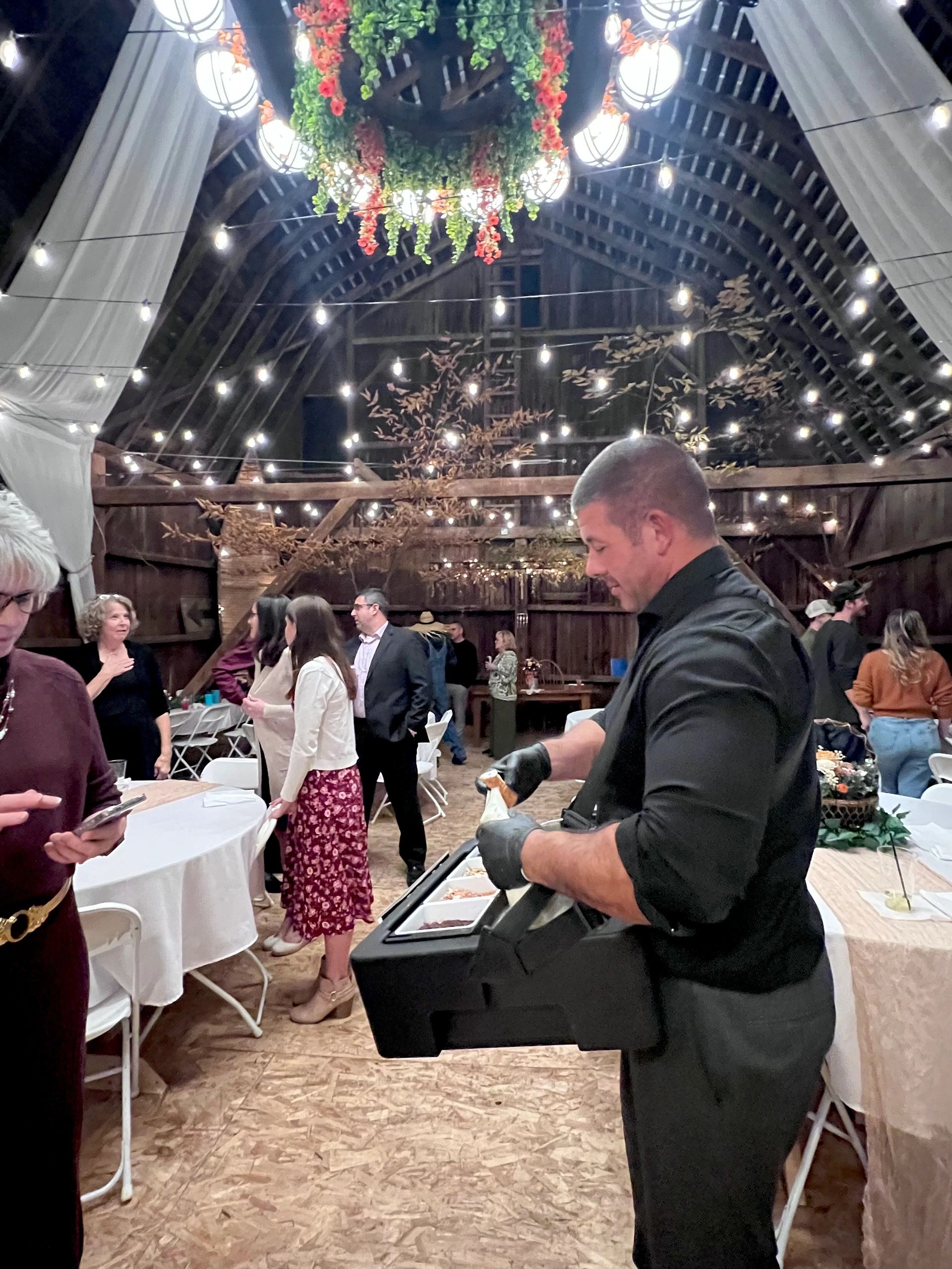 Walking cannoli attendant serving desserts at luxury Rochester wedding