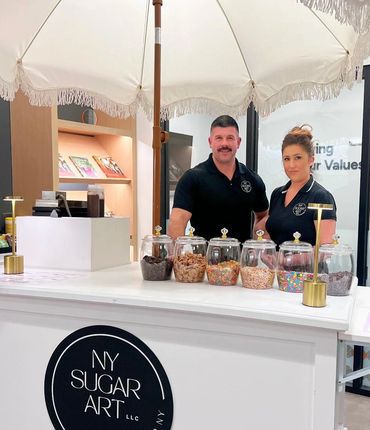 the dessert cart with two employees posing for the camera ready to serve guests