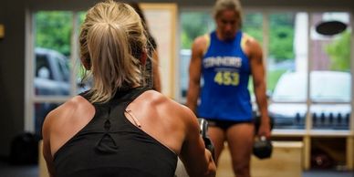 Two women participated in a group fitness class at Orleans CrossFit and OCFIT. 