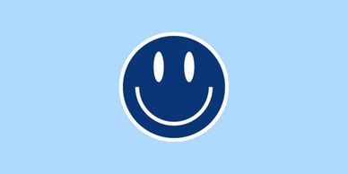 A graphic with a dark blue and white smiley face on a light blue background