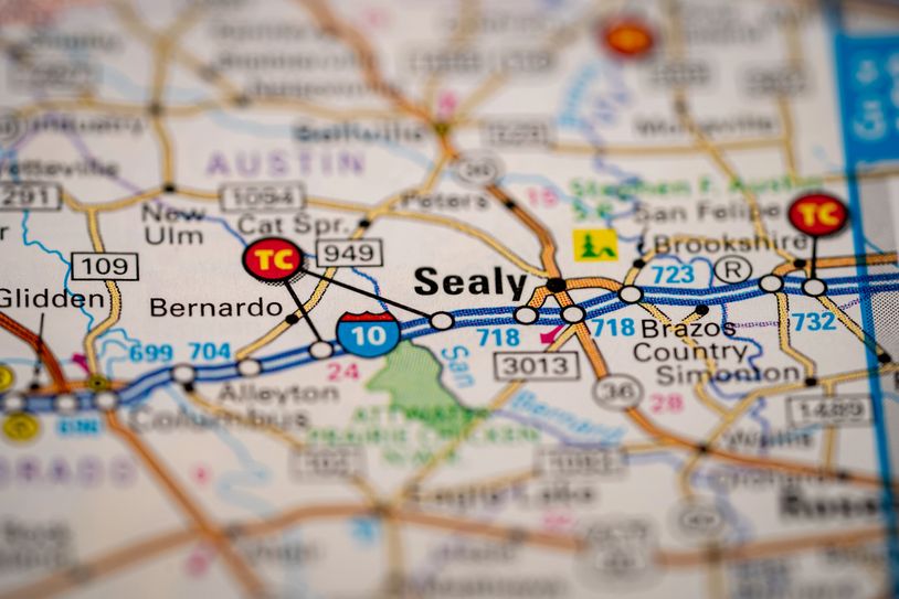 Close-up of a map highlighting Sealy and surrounding Texas towns with highways and roads.