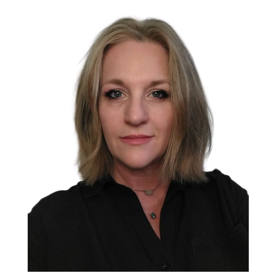 Portrait of a woman with blonde hair and a black shirt.