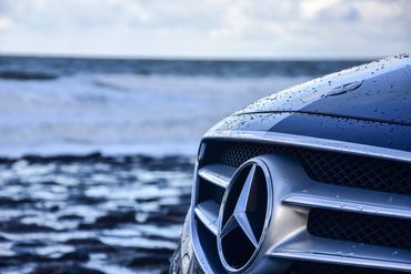 DE Chauffeurs Mercedes Benz E Class exterior front grille next to river Thames London