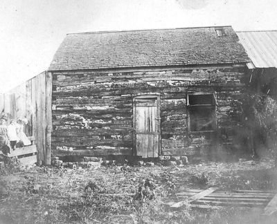 Schneider log cabin on E. 7th Street, northwest of Eudora city cemetery