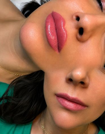 Close-up of a woman's face and lips with smooth skin and natural makeup.