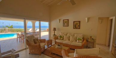 Private villa in Pelican Key on Sint Maarten overlooking the ocean with a private pool.