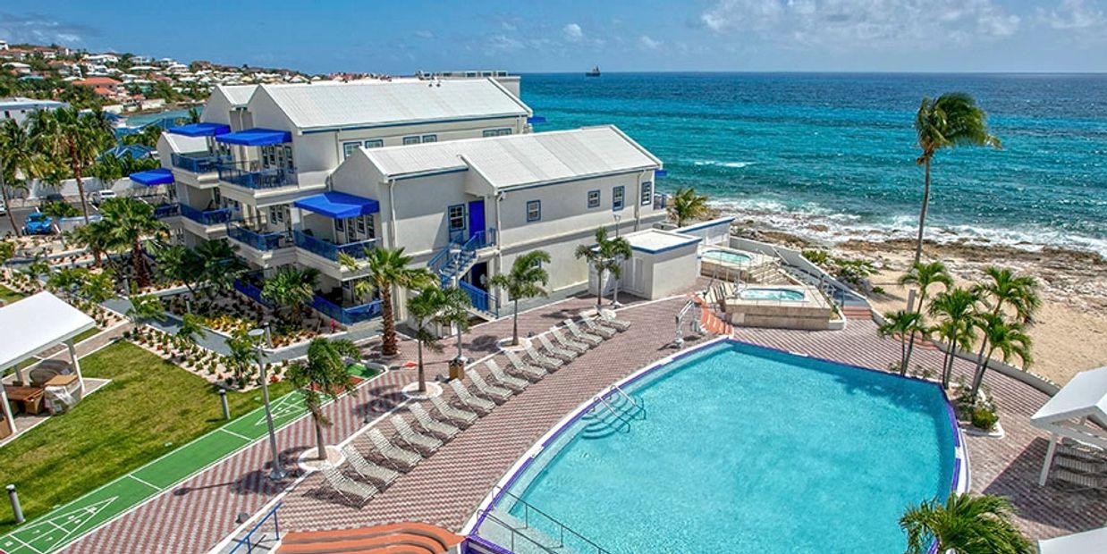 Flamingo Beach Resort pool area & ocean villas.