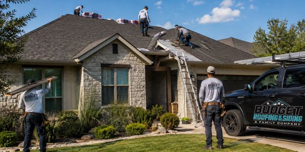 Workers repairing a roof on a house.