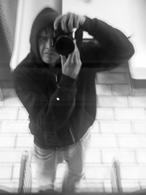 Black-and-white self portrait of Zach Tuggle, a writer a photographer in Ohio.