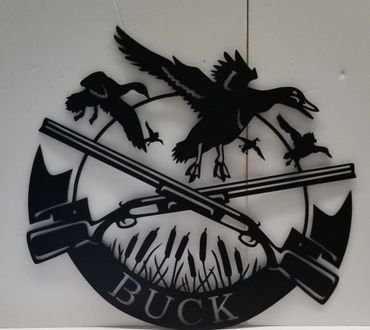 Black silhouette logo featuring ducks, rifles, and the word BUCK.