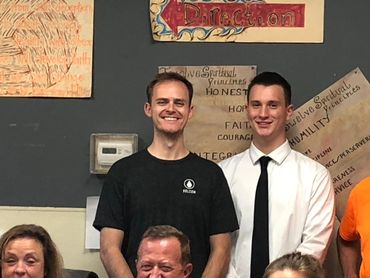 Casual group of friends standing and posing for the camera