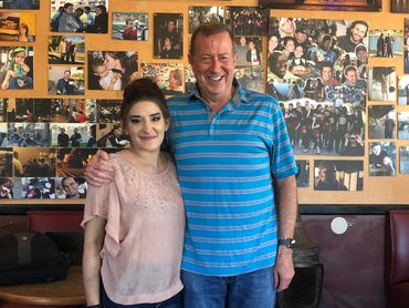 Man and woman standing with looking on the camera