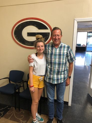  two friends standing together and looking forward