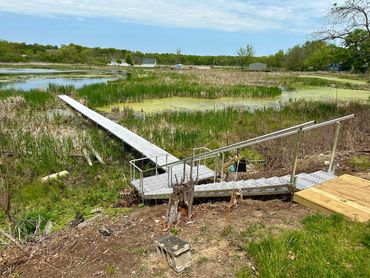 EZ Beach Steps & Dock System, Spring Lake Michigan. Hill side installation.  Marshy area dock and st