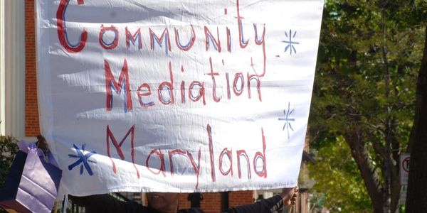 Banner with 'Community Mediation Maryland'.