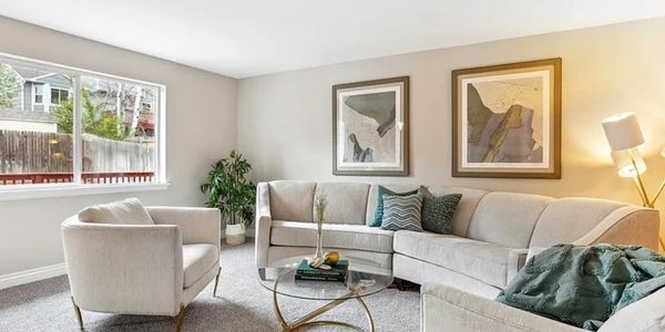 Home staging experts furnishing a vacant home in Denver, CO.