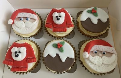 Christmas Cupcakes from Poppy's Cupcakes London , Topped  with  handmade festive Toppers. £20