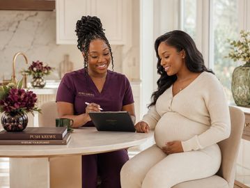 Pregnant woman consulting a healthcare professional.