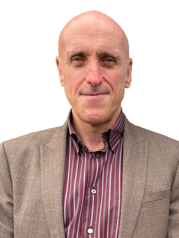 Portrait of a bald man in a brown blazer and striped shirt.