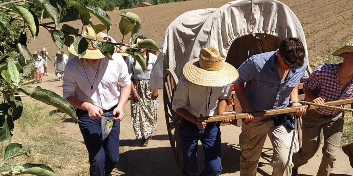 Students reenacting the Martin and Willie handcart company and the trails they went on.